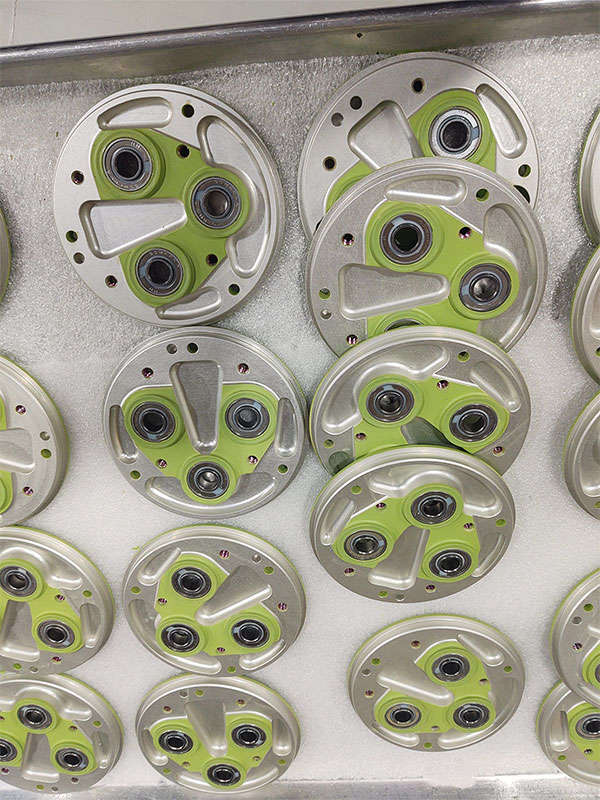 A bunch of green and white plates on a table.