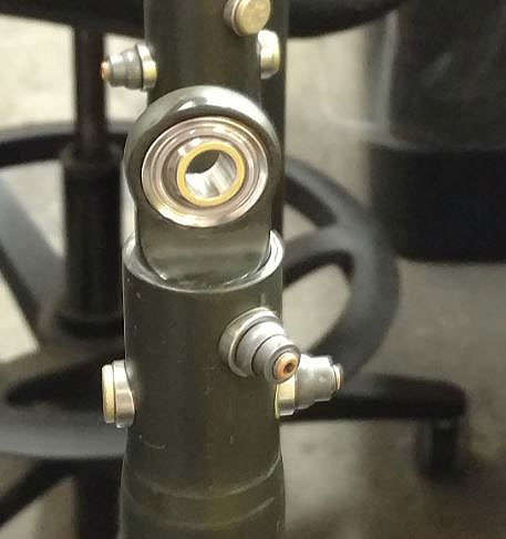 A close up of a metal rod with a bolt on it.