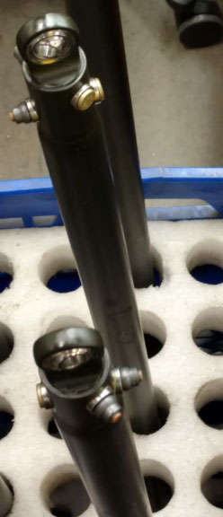 A group of metal rods sitting on a tray.