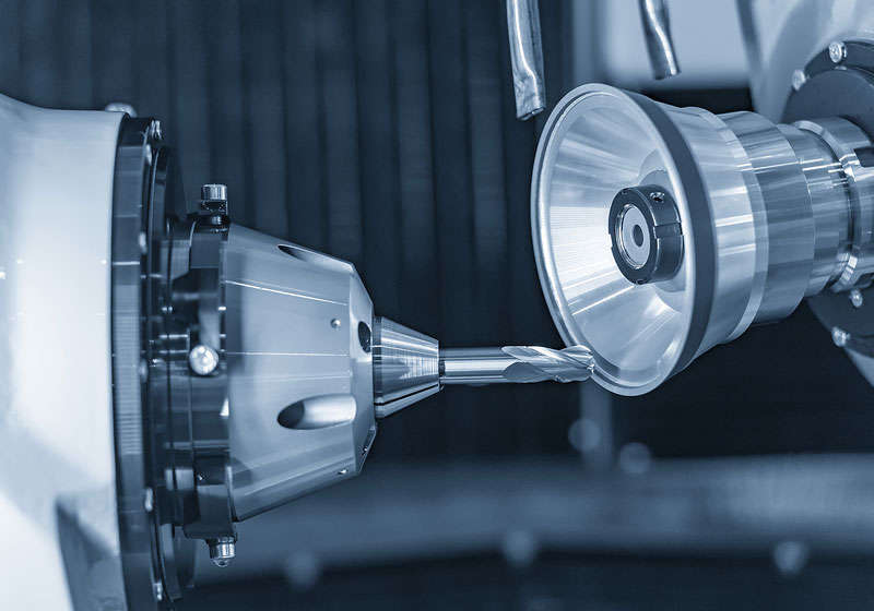 A CNC machine is being used for aerospace part manufacturing.