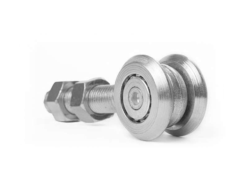 A stainless steel roller in a manufacturing setting.