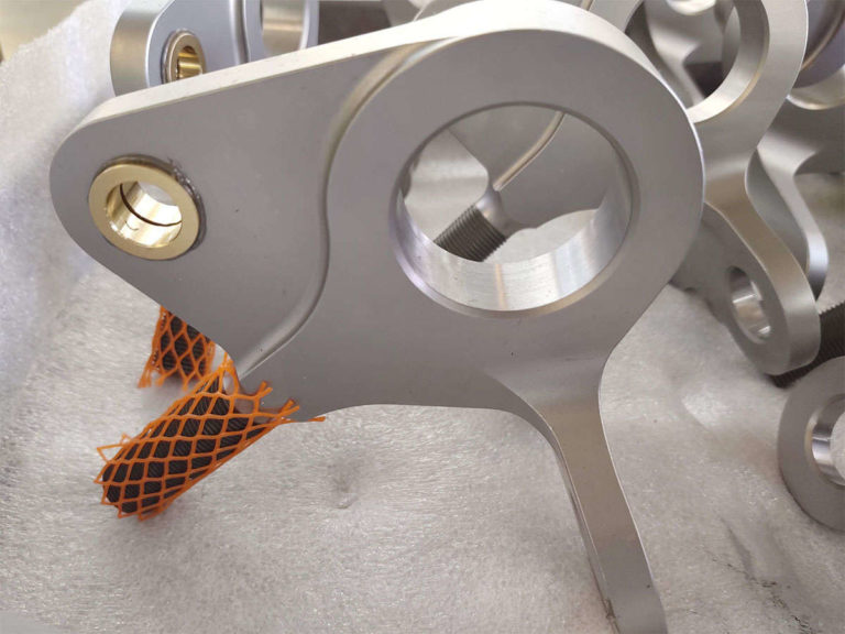 Assembly of metal parts on a table.