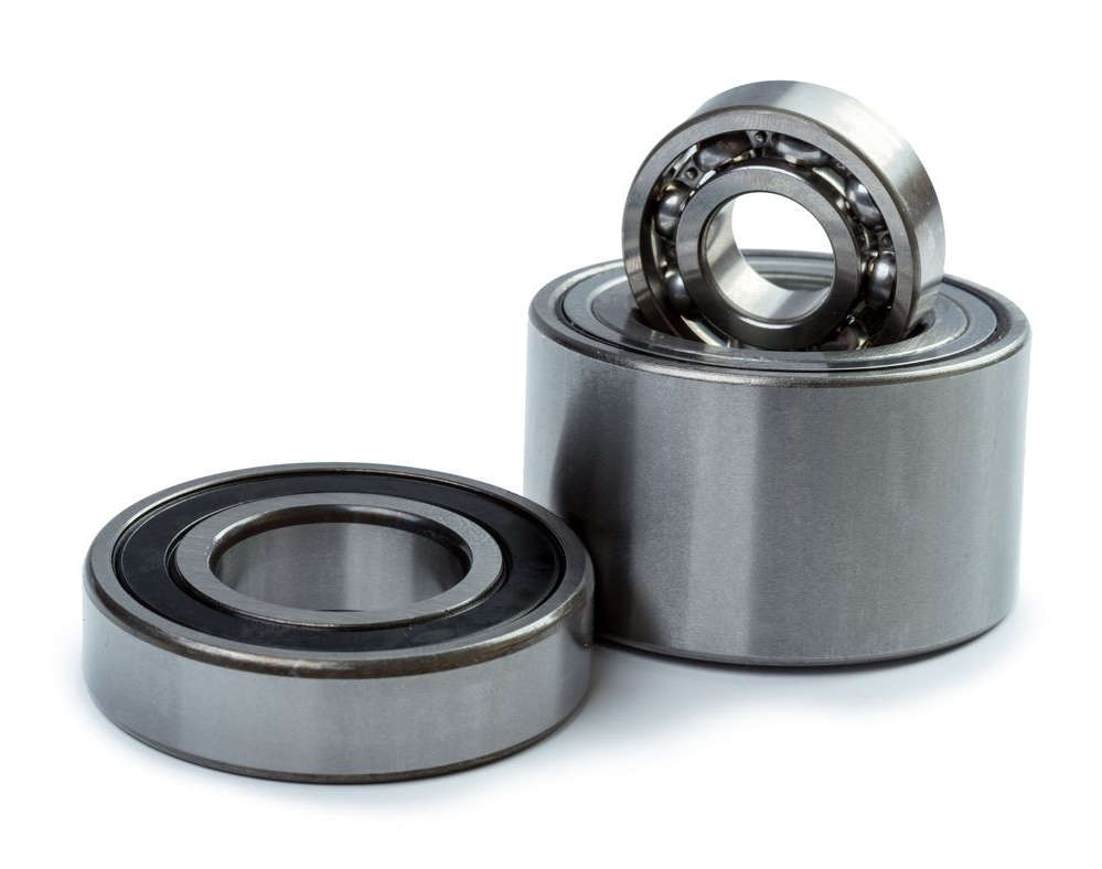 Two ball bearings on a white background placed with bushing installation.