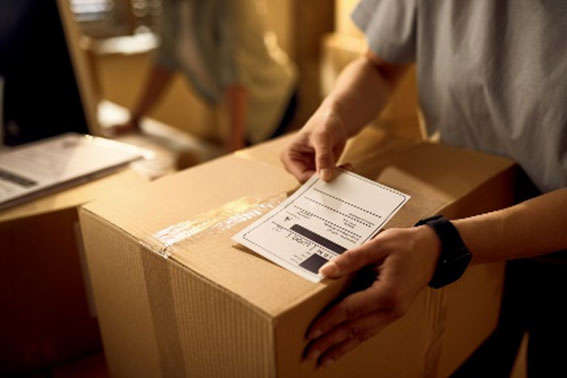 A person is assembling and integrating a package into a box.